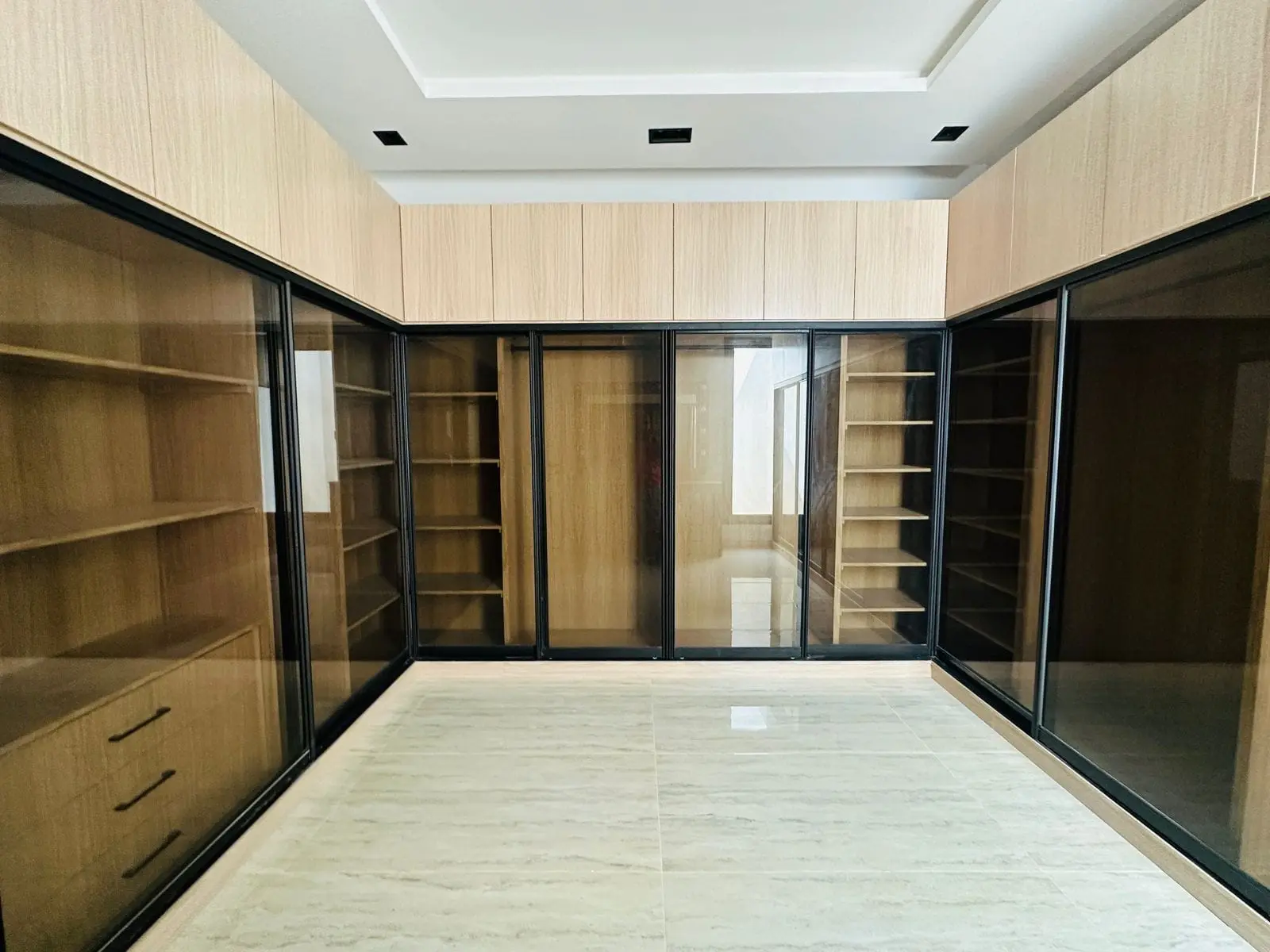 Walk-in wardrobe with glass sliding doors